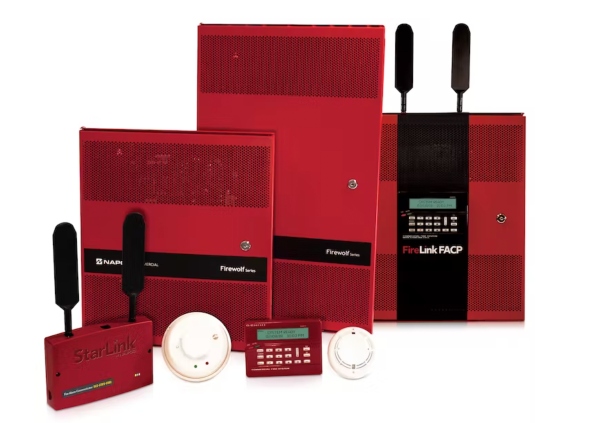 Technician working on a fire alarm control panel